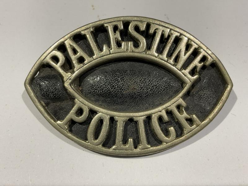 Palestine Police white metal shoulder title