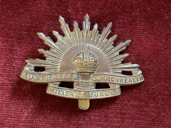 WW1 British made rising sun cap badge