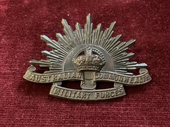 WW2 rising sun A.I.F cap badge by STOKES