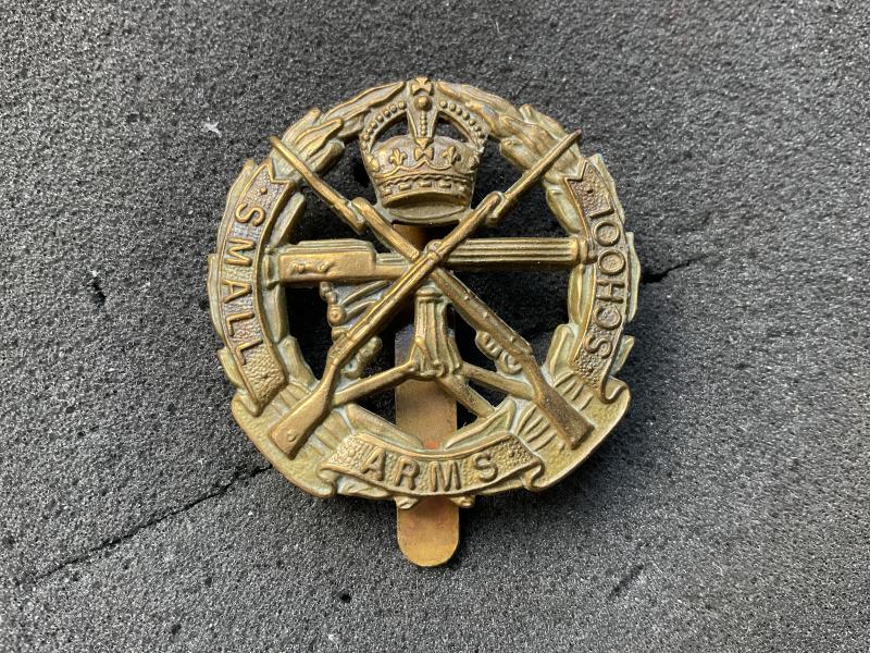K/C Small Arms School brass cap badge
