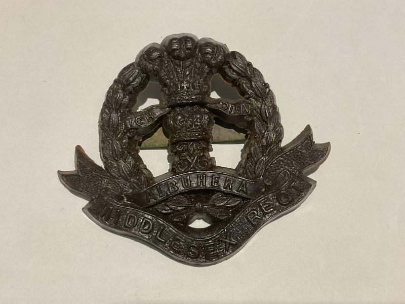WW2 Middlesex Regiment plastic economy cap badge