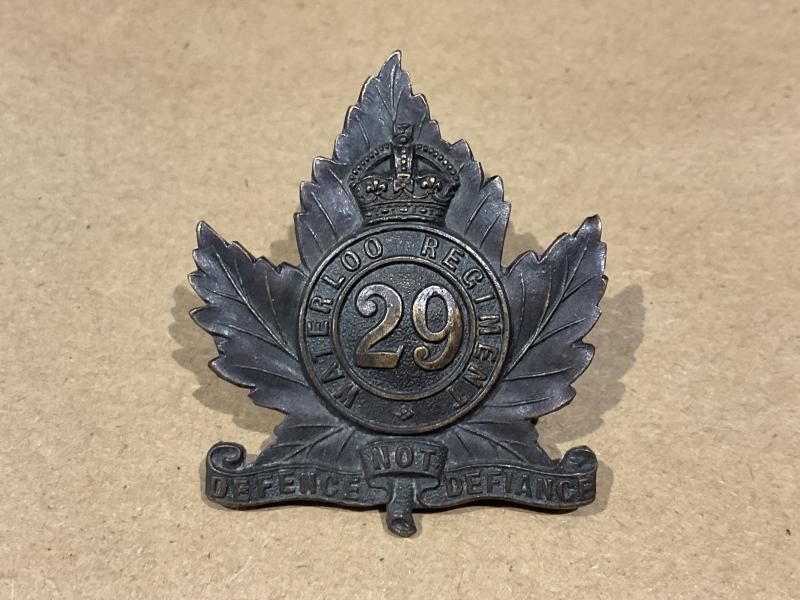WW1 C.E.F 29th Waterloo Regt cap badge by Gaunt