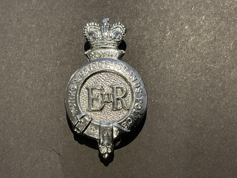Q/C Turks & Caicos Islands Police cap badge.