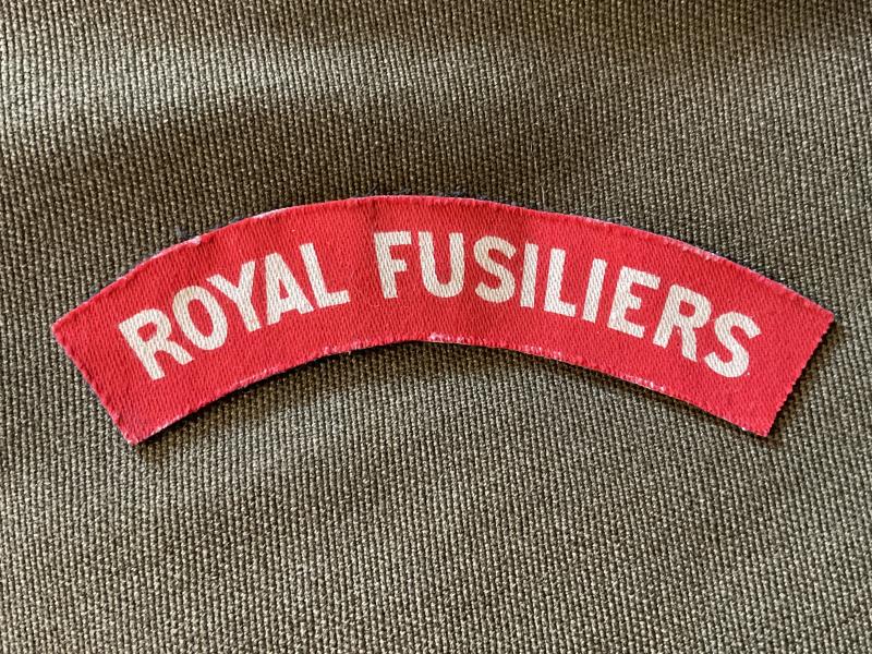 WW2 Printed ROYAL FUSILIERS shoulder title.