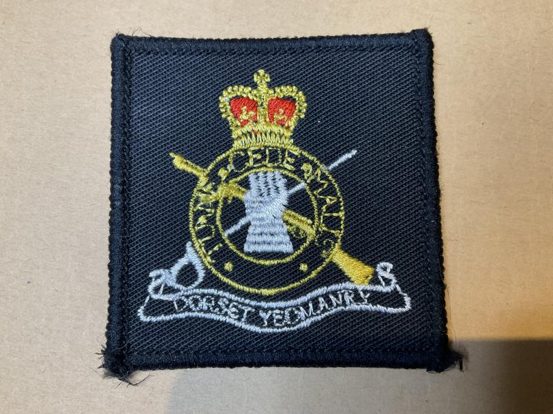 Dorset Yeomanry beret badge or T.R.F cloth badge.
